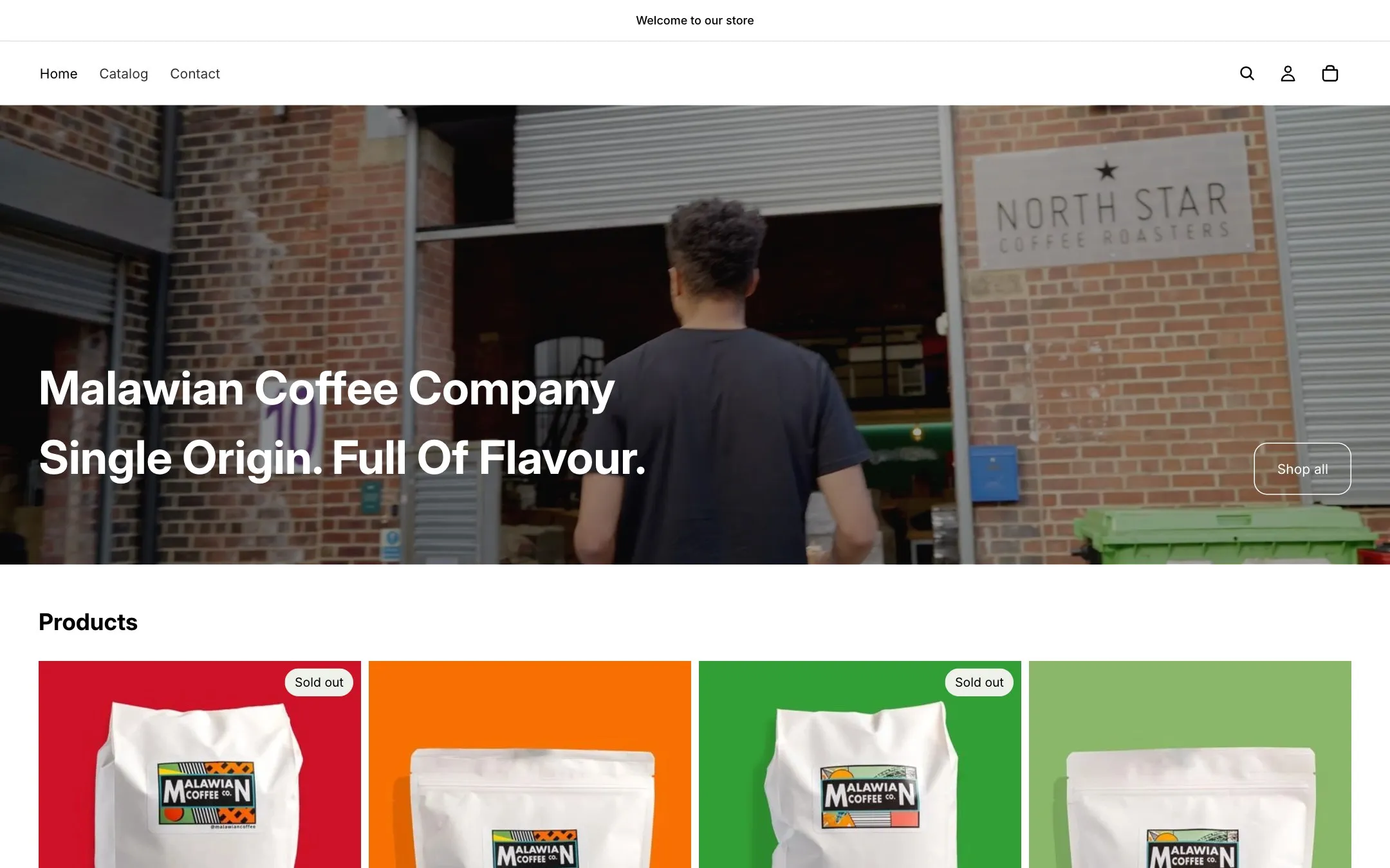 The old Malawian Coffee homepage: a 'Welcome to our store' bar, a plain black-and-white menu and the headline 'Malawian Coffee Company, Single Origin. Full Of Flavour.'